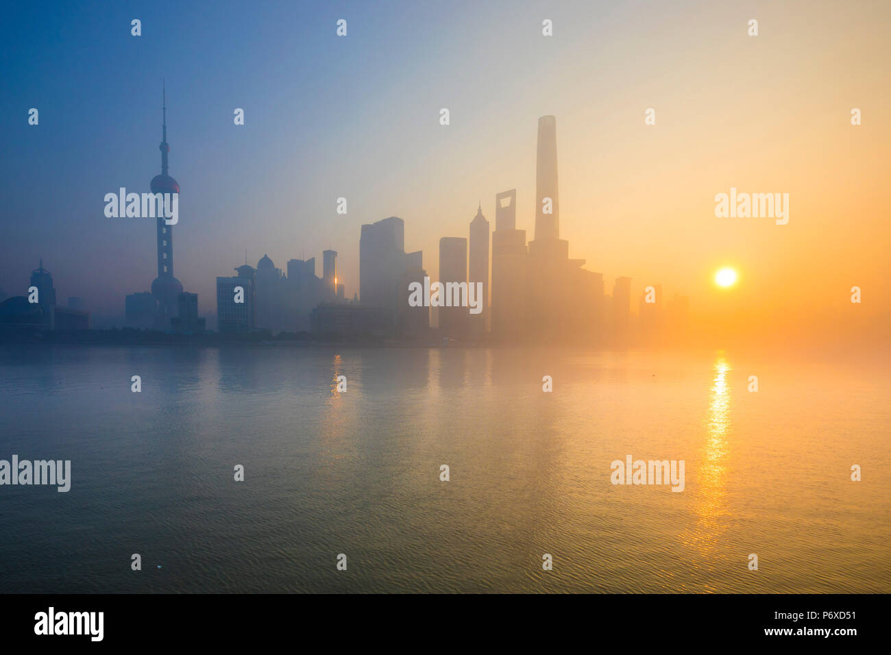 Skyline of Pudong from The Bund on a foggy November morning, Shanghai, China Stock Photo