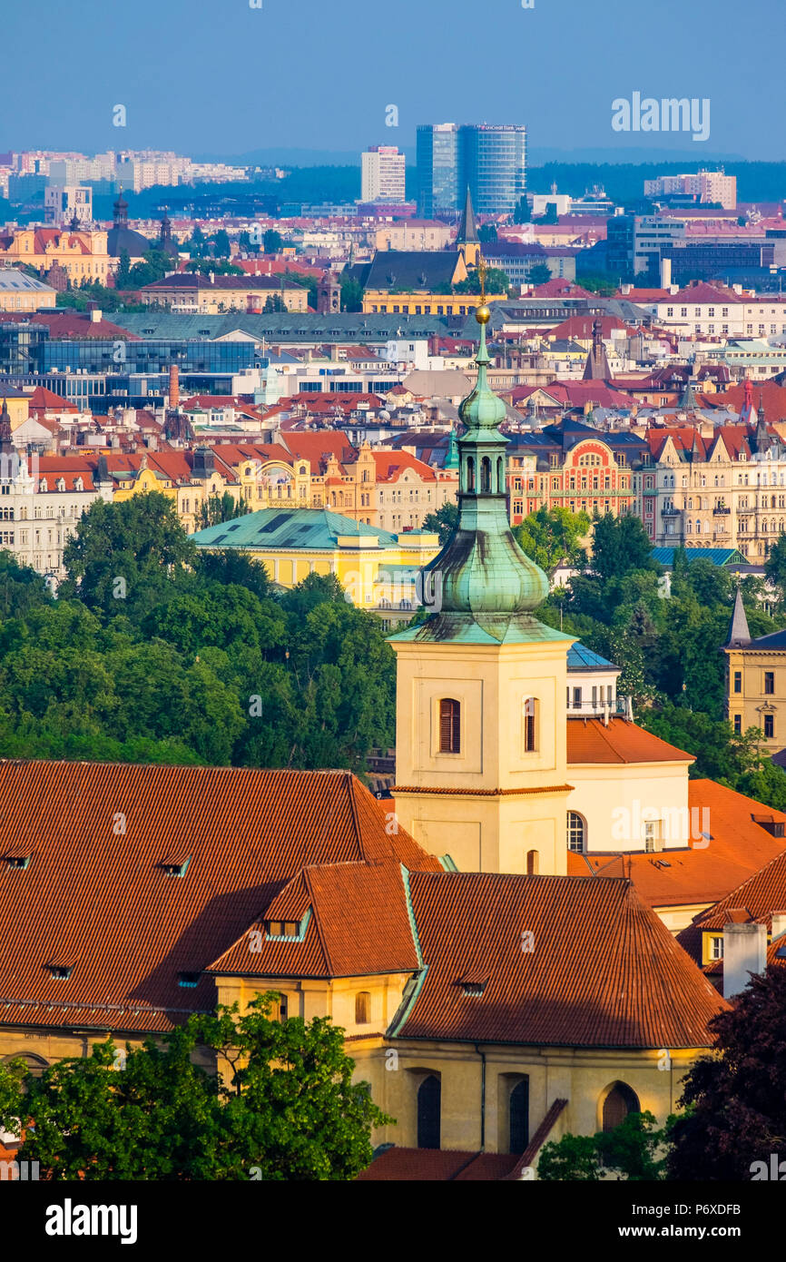 Czech Republic, Prague. Steeple of Church of Our Lady Victorious and buildings in Nove Mesto, New Town. Stock Photo