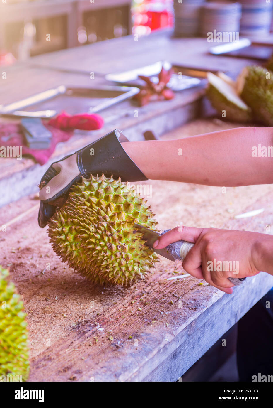 peeling durian by knife. Thai King fruit Stock Photo Alamy