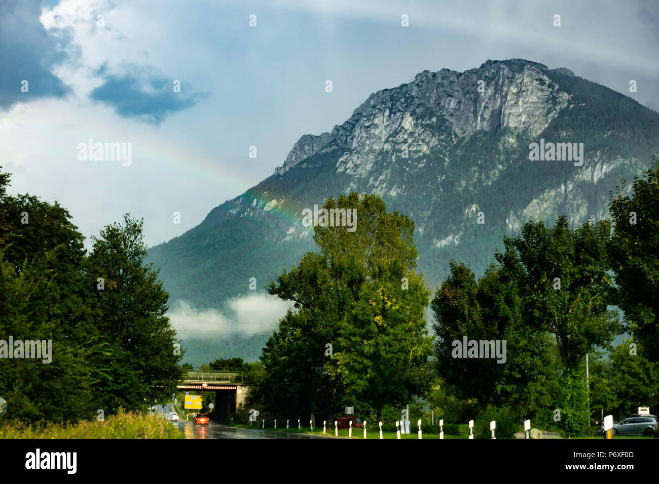 Rainbow over a mountain in the Bavarian countryside Stock Photo