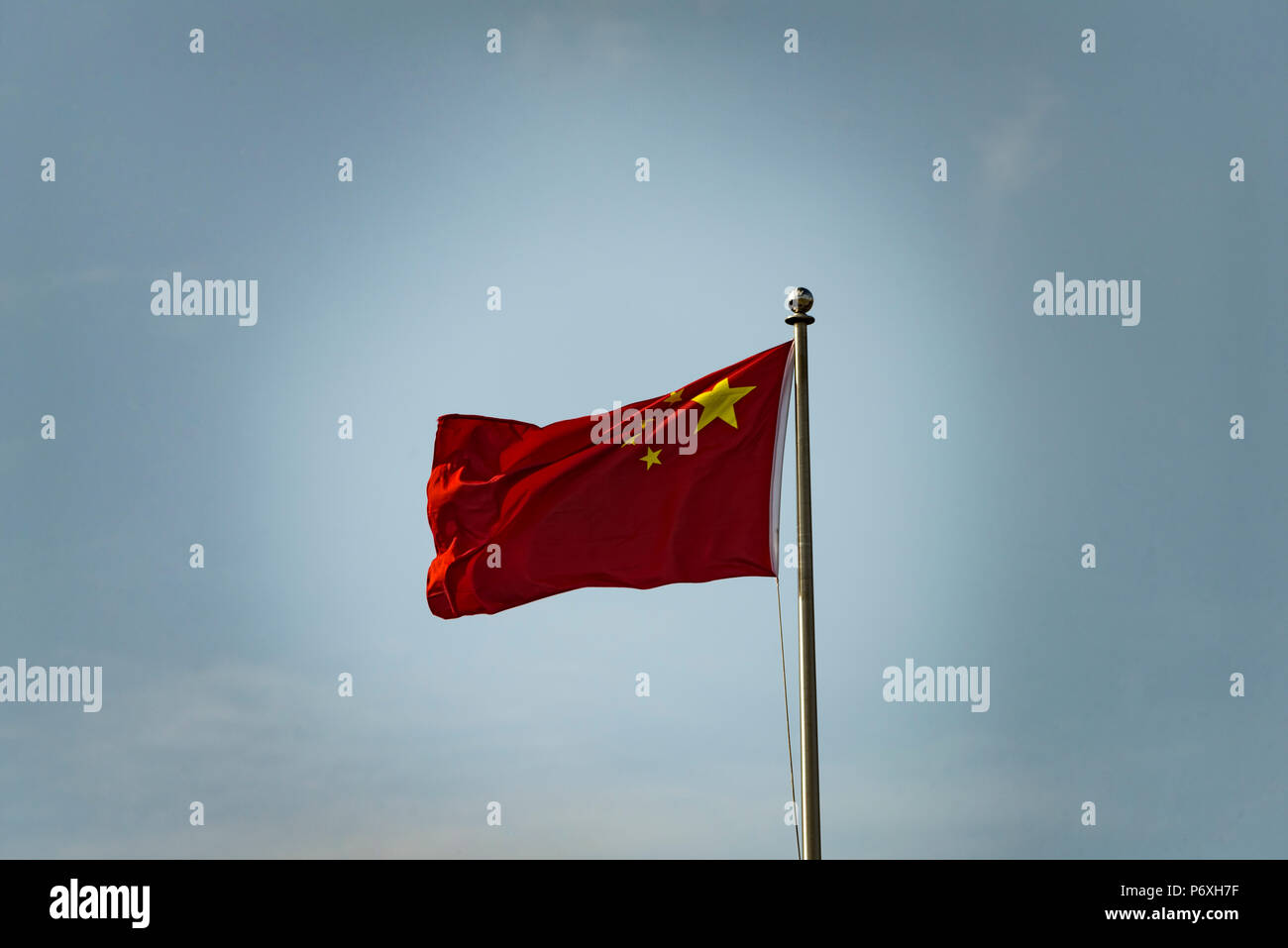 Flag of the People's Republic of China on a flagpole f;uttering in the wind Stock Photo