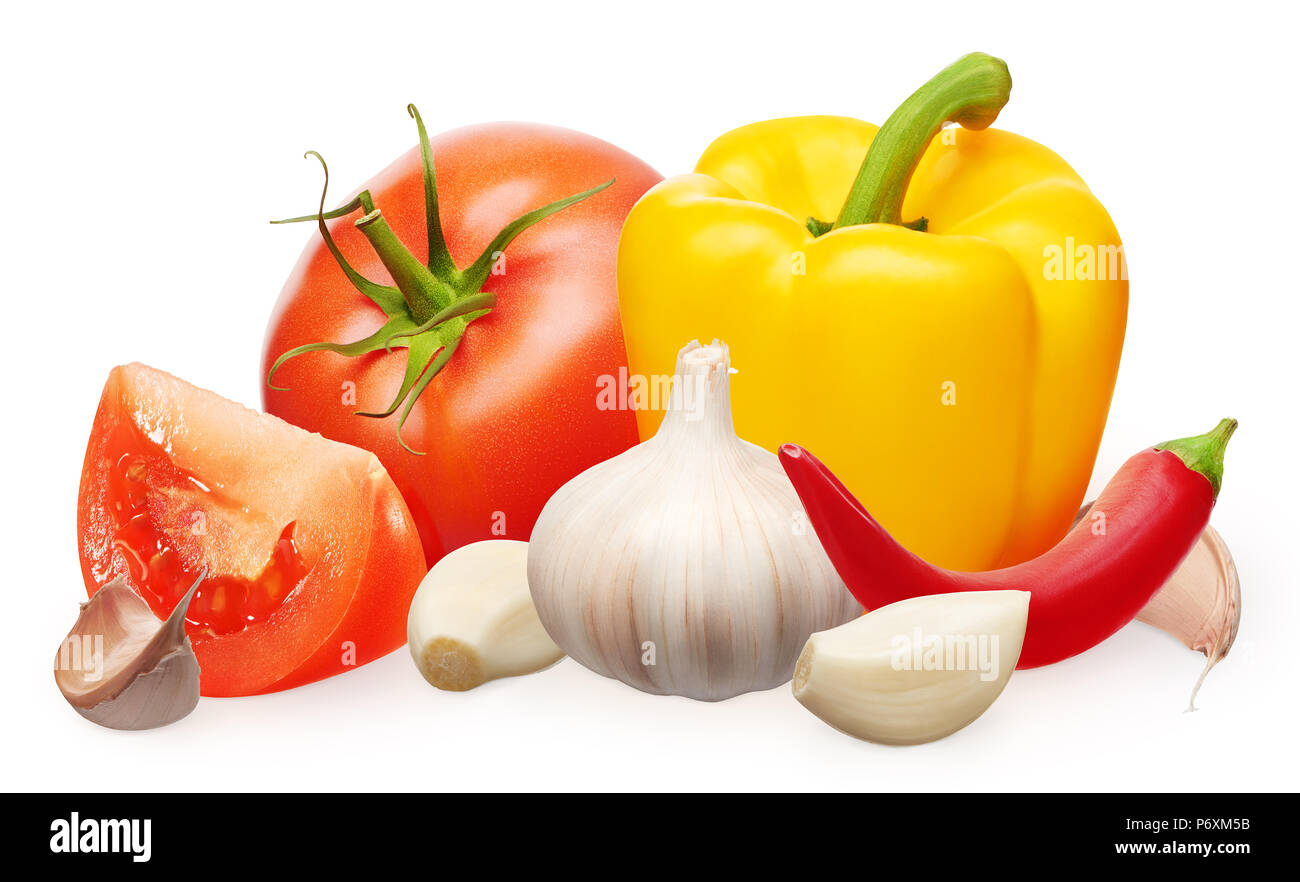 Whole fresh red tomato with green leaf and slice, yellow bell and red chili peppers and garlic with cloves isolated on white background Stock Photo