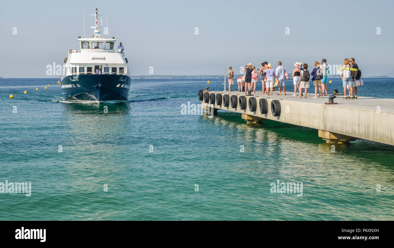Tourists wait to board a ferry to take them to destinations on the French  Riviera including Cannes and St. Tropez Stock Photo - Alamy