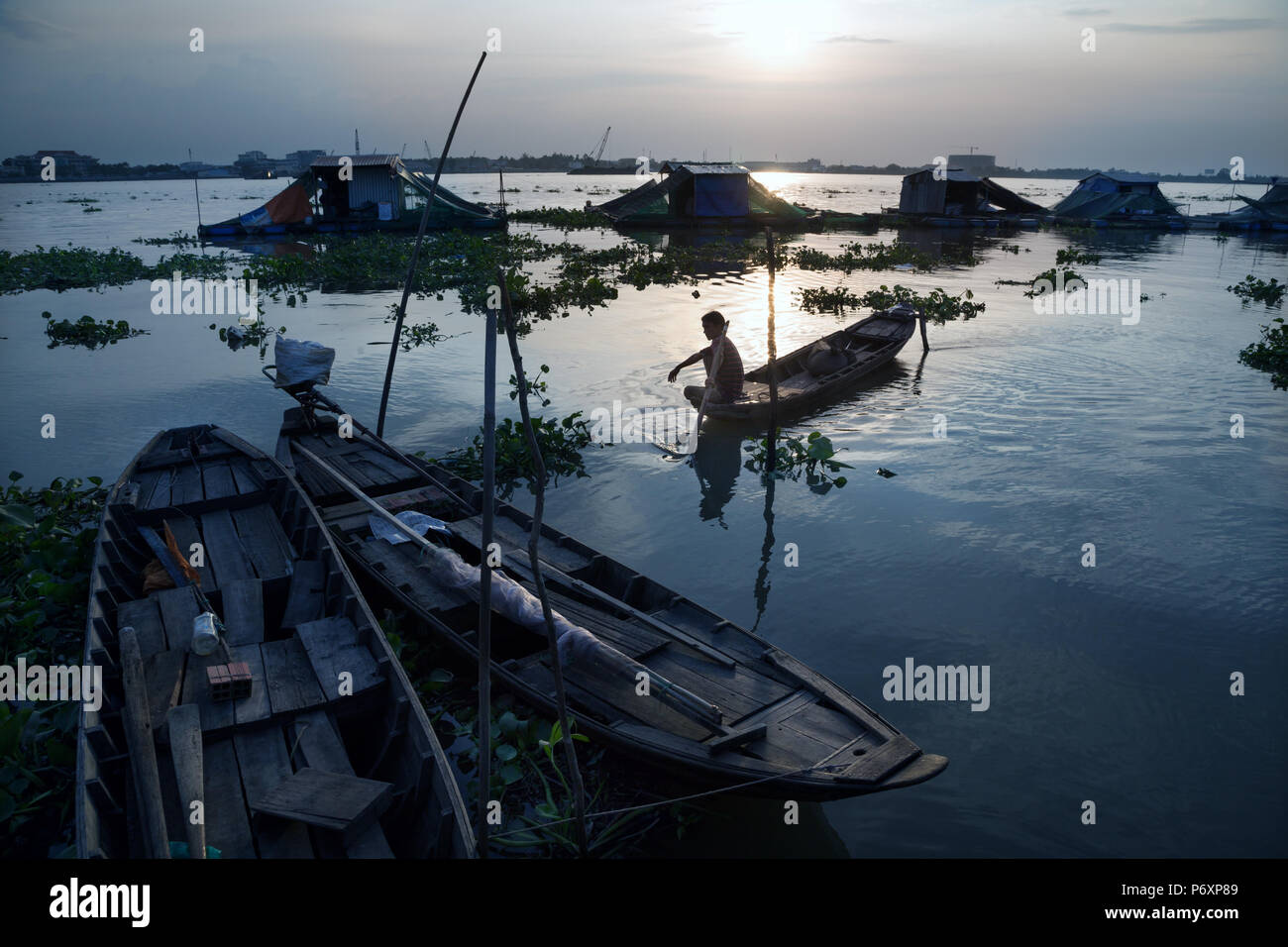 Amazing sunset landscape on Mekong river with boat from An Binh island , Vietnam Stock Photo