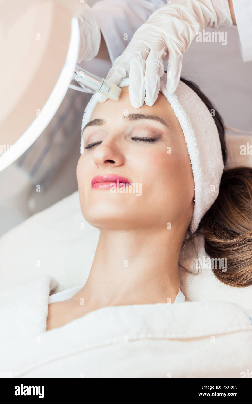 Close-up of the face of a woman relaxing during non-surgical facelift Stock Photo