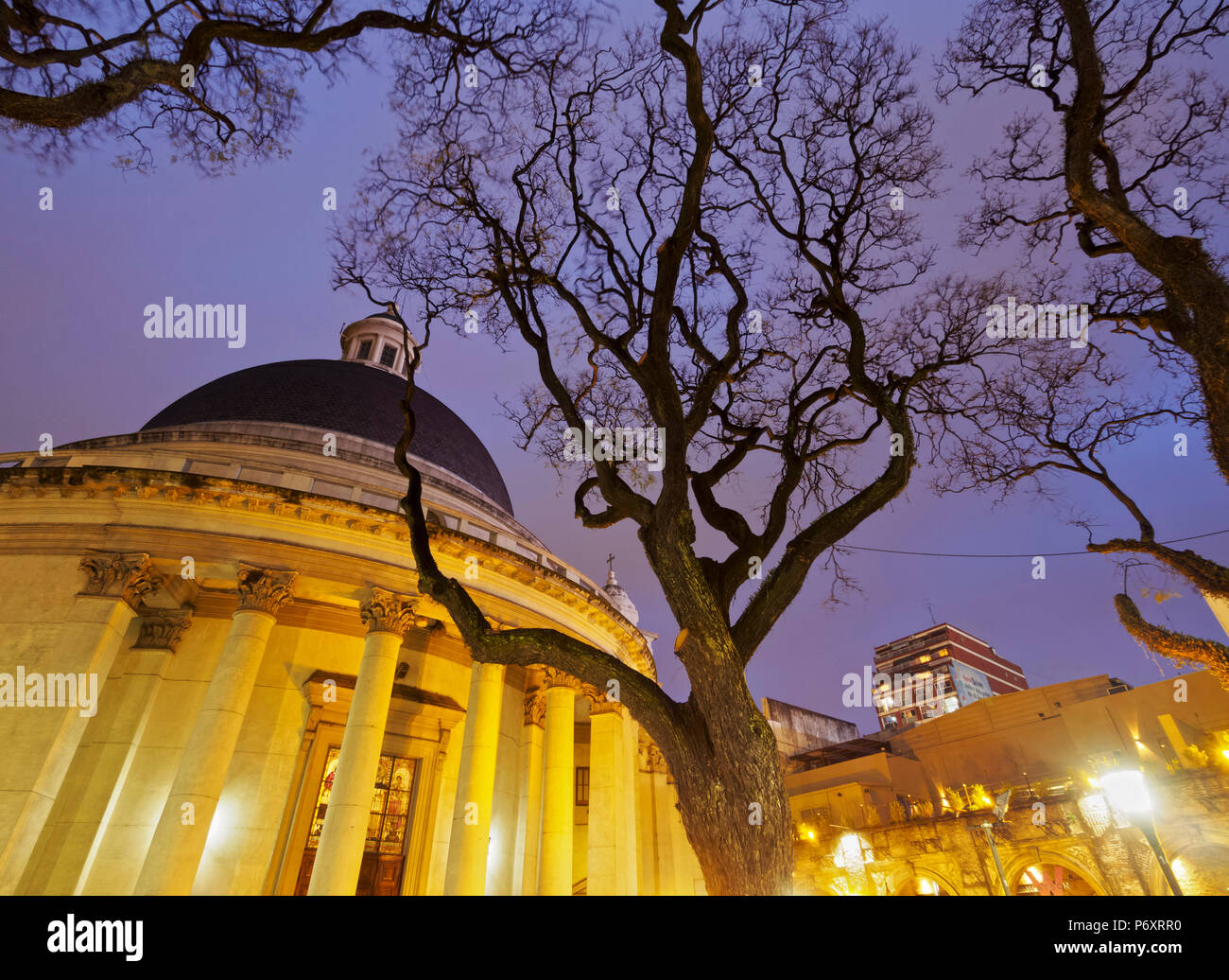 Argentina, Buenos Aires Province, City of Buenos Aires, Belgrano, Twilight view of the Plaza Manuel Belgrano and Inmaculada Concepcion Church known as La Redonda. Stock Photo