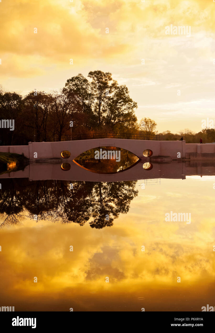 Argentina,  Buenos Aires Province, San Antonio de Areco, View of the Areco River and the Old Bridge at sunset. Stock Photo