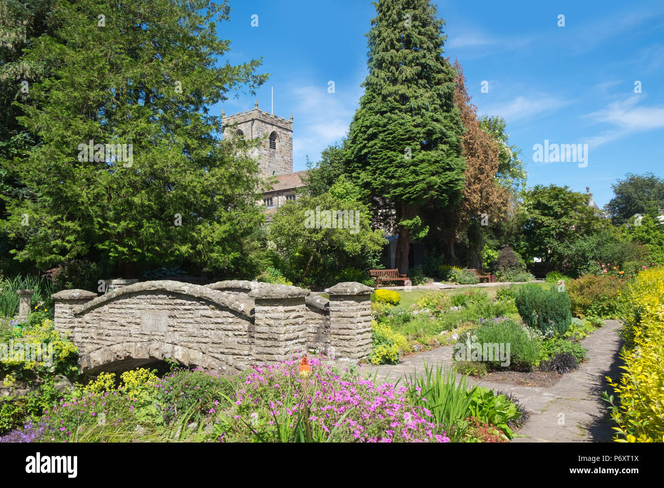 Waddington, Clitheroe, Lancashire, UK. Pretty gardens in the centre of the village with church tower in background. Stock Photo