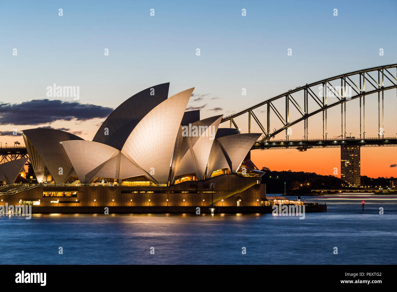 Sydney at sunset. Opera house from Mrs Macquaries Chair. New South Wales, Australia Stock Photo