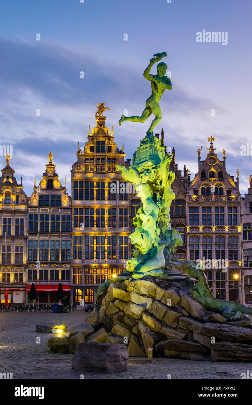 Belgium, Flanders, Antwerp (Antwerpen). Medieval guild houses and statue of Silvius Brabo on Grote Markt square at dawn. Stock Photo