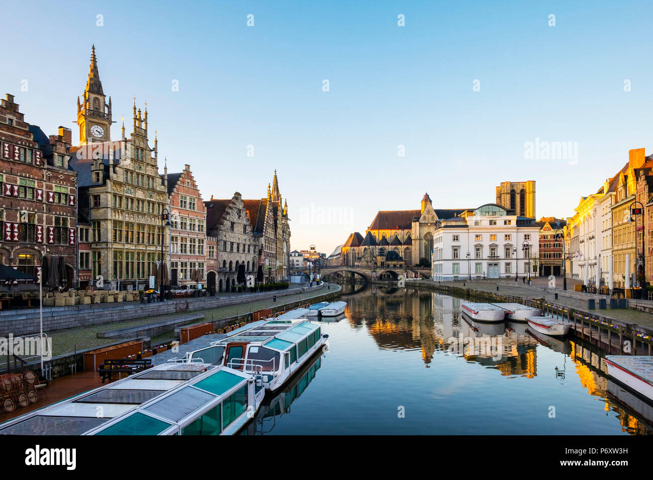 Belgium, Flanders, Ghent (Gent). The Leie River and buildings along Graslei quay at dawn. Stock Photo