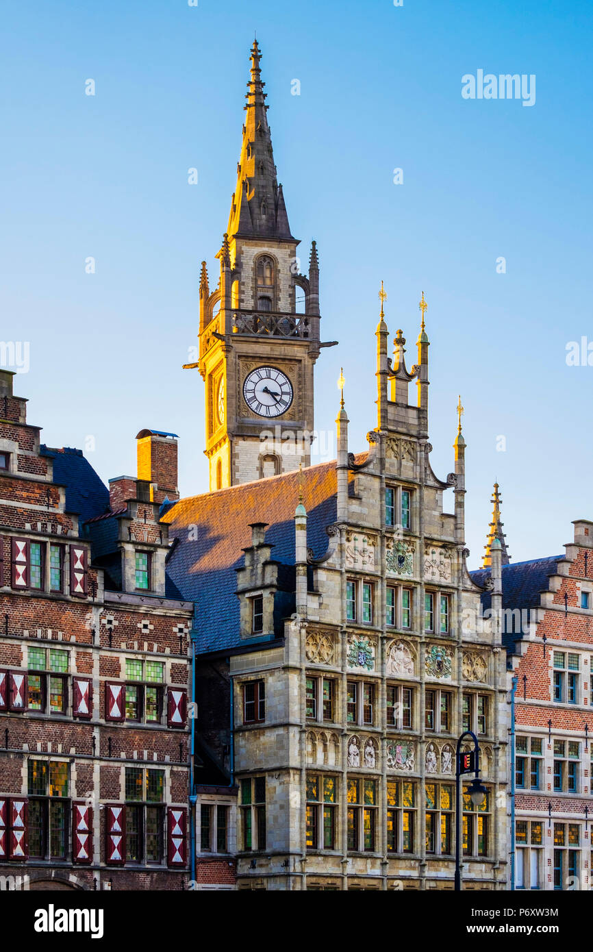 Belgium, Flanders, Ghent (Gent). Old Post Office clocktower and medieval guild houses on Graslei. Stock Photo