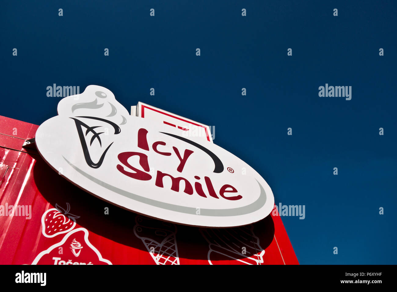 sign of Icy Smile, ice cream Czech chain, on the top of a street stand Stock Photo