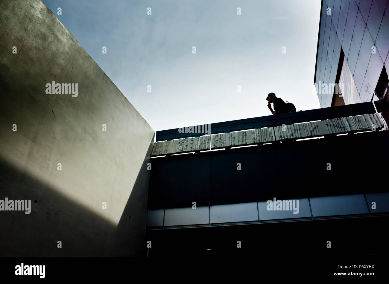 Man walking on a bridge hi-res stock photography and images - Alamy
