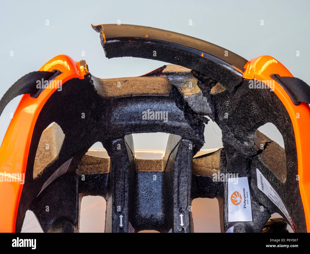A bicycle helmet cracked and broken after the cyclist wearing the bike