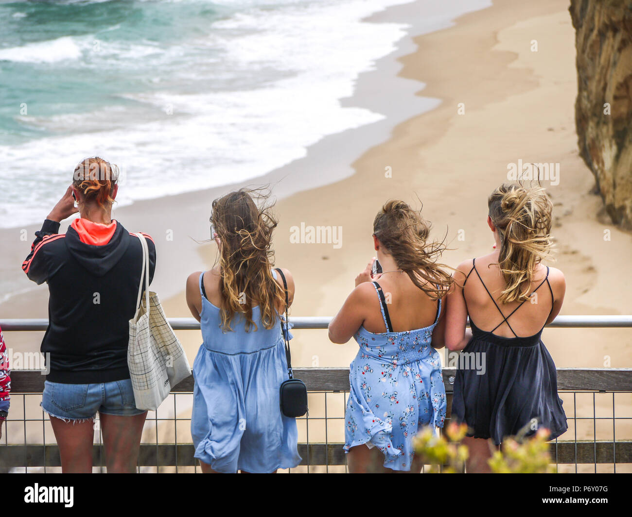 Young female tourists at viewing platform of the Twelve Apostles by the Great Ocean Road. Victoria, Australia Stock Photo