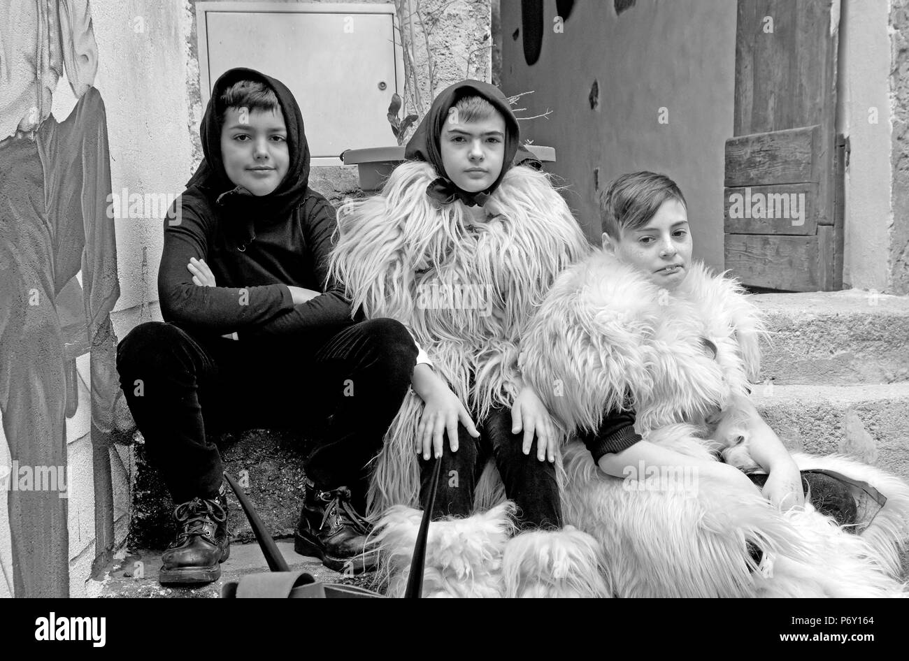 portrait of children at the Ottana carnival, Sardinia, Italy, black and white Stock Photo