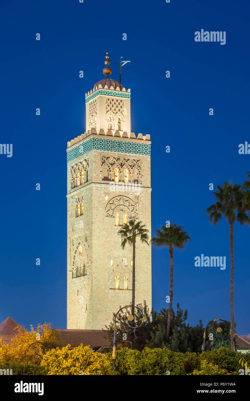 Morocco, Marrakech-Safi (Marrakesh-Tensift-El Haouz) region, Marrakesh. 12th century minaret of the Koutoubia Mosque at dusk. Stock Photo