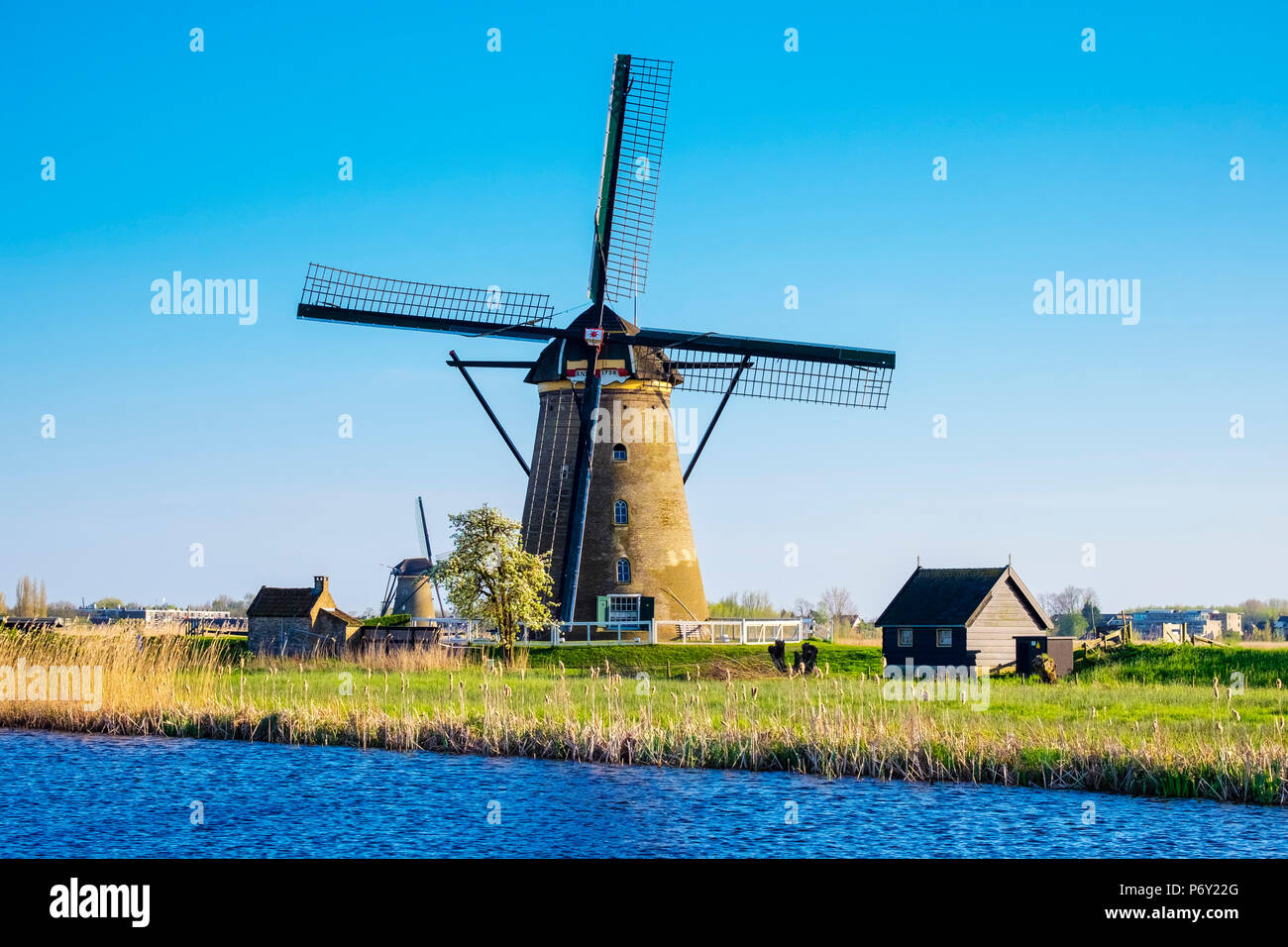 Netherlands, South Holland, Kinderdijk, UNESCO World Heritage Site. Historic Dutch windmill on the polders. Stock Photo
