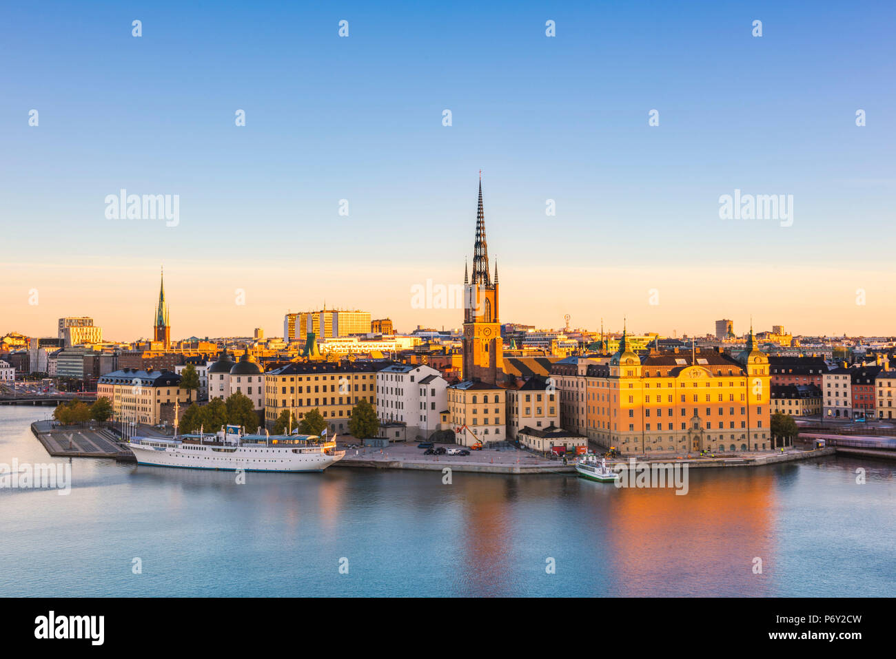 Stockholm, Sweden, Northern Europe. High angle view over Riddarholmen and Riddarholmskyrkan (church) at sunrise. Stock Photo