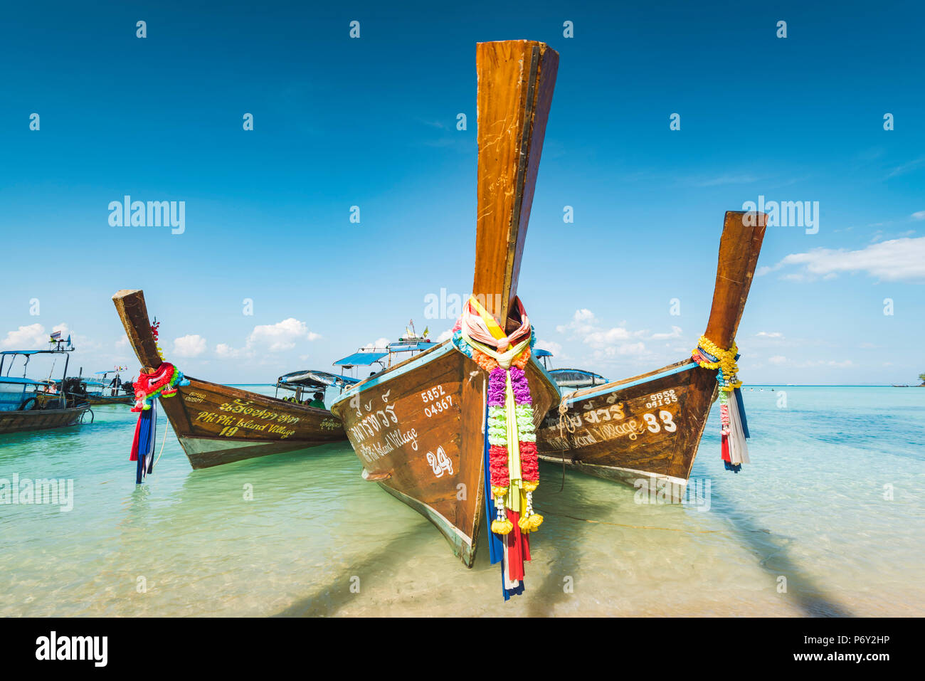 Ao Lo Bakao (Lo Bakao Bay), Ko Phi Phi Don, Krabi Province, Thailand. Traditional longtail boats on the beach. Stock Photo