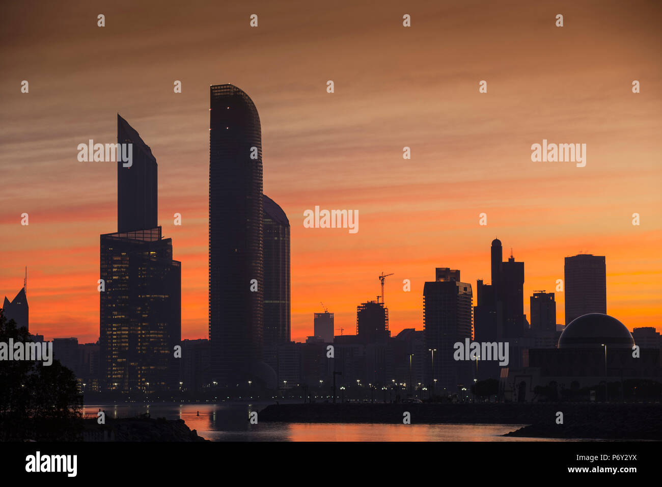 United Arab Emirates, Abu Dhabi, View of City skyline at sunrise Stock Photo