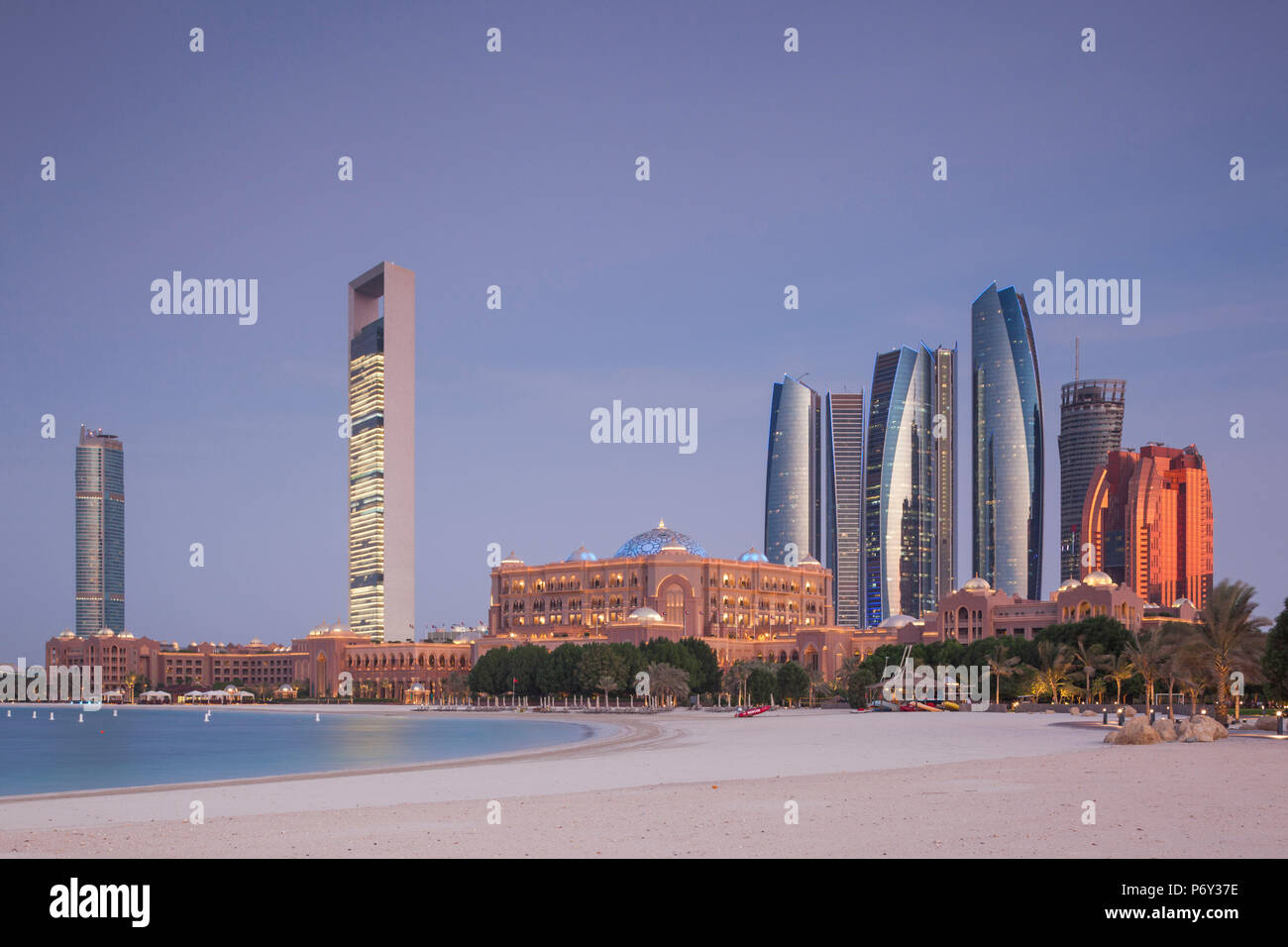 UAE, Abu Dhabi, skyline, Nations Towers, ADNOC Tower, Etihad Towers and Emirates Palace Hotel, dusk Stock Photo