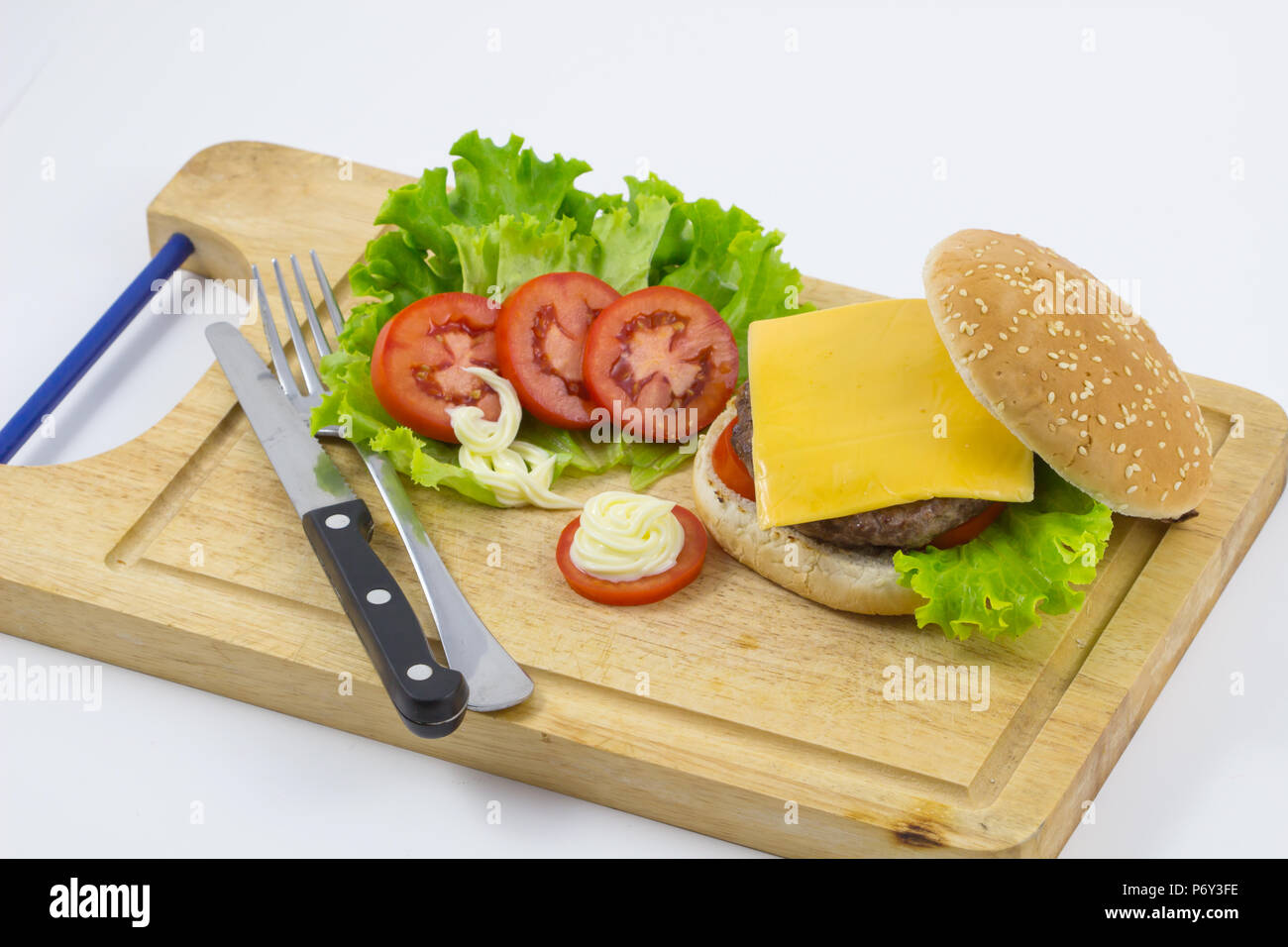 Home made hamburger with lettuce, tomato, cheese, beef meat and french fries placed on wooden background , Fresh tasty burger background, Stock Photo