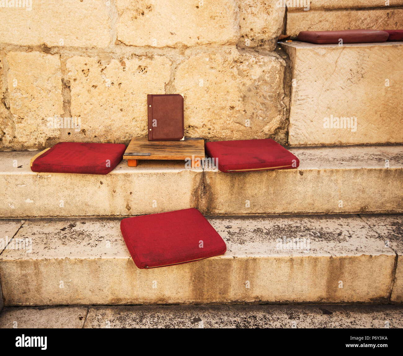 Old red retro Hassock on floor background / vintage red hassock on