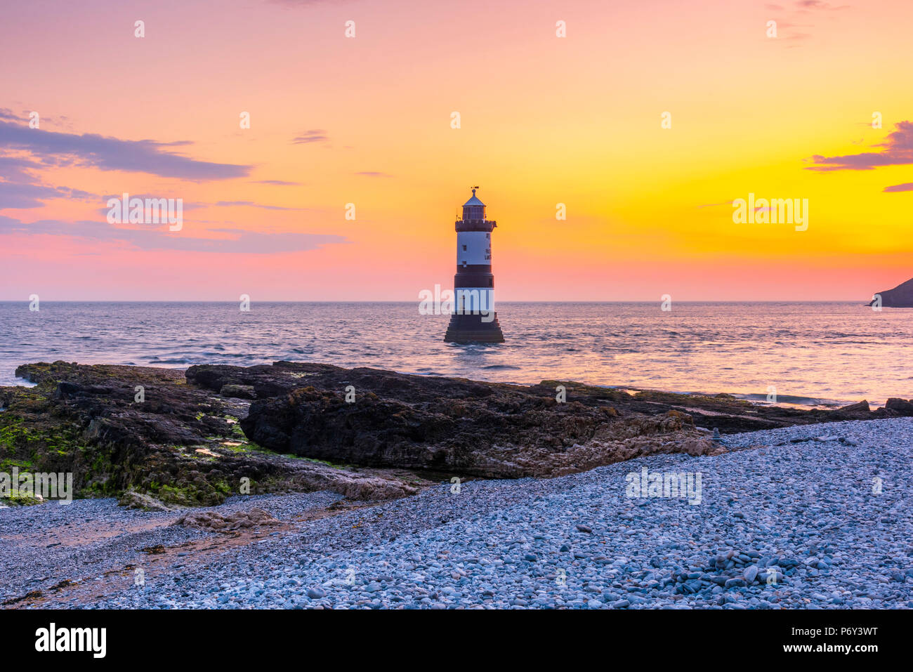 UK, Wales, Anglesey, Penmon, Black Point, Trwyn Du Lighthouse (Penmon Lighthouse) at sunrise Stock Photo