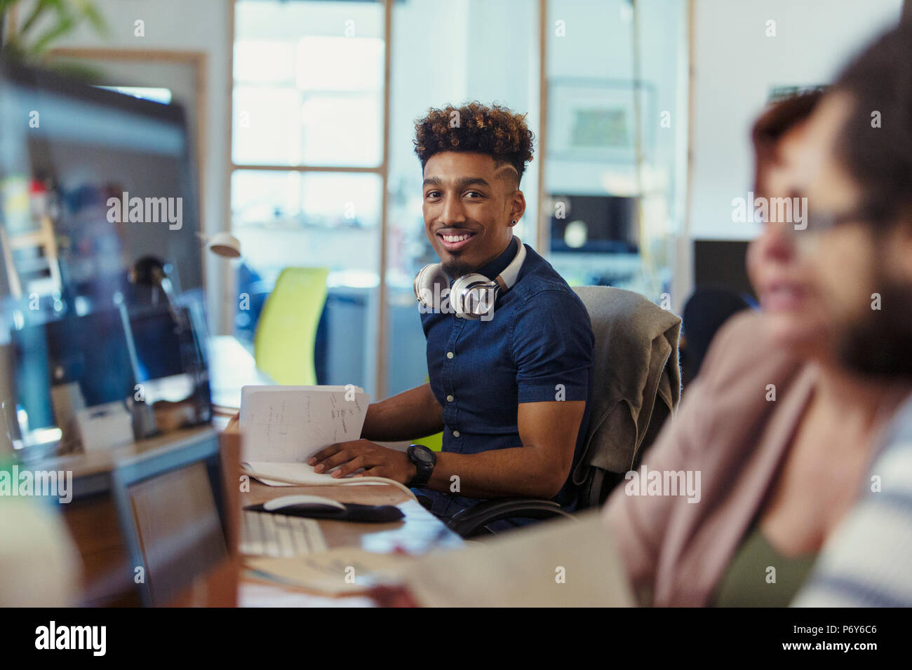 Portrait smiling, confident creative businessman working in office Stock Photo