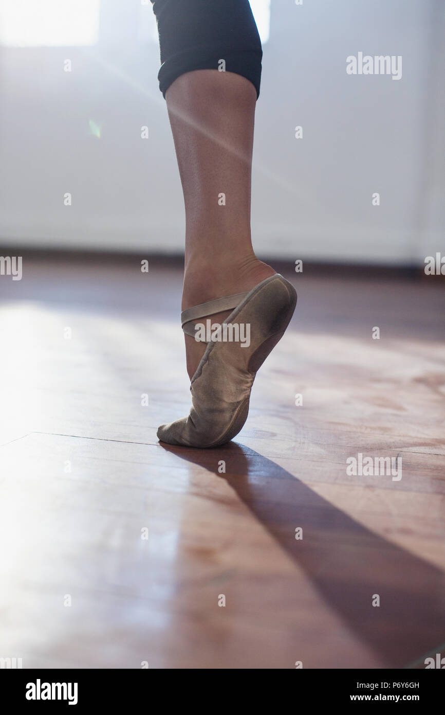 Close up young female ballet dancer practicing in ballet shoe Stock Photo
