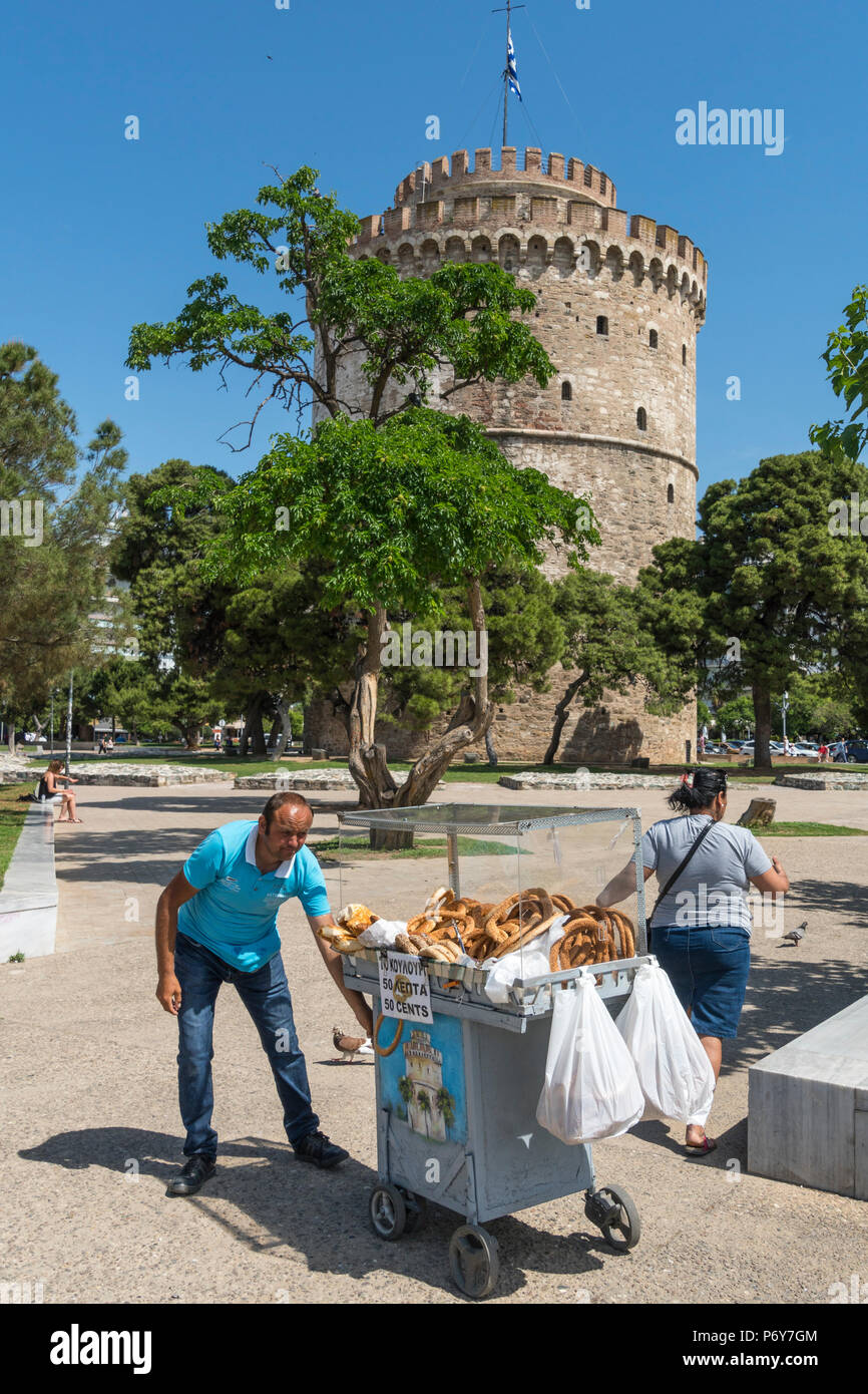 Street vendor selling Koulouri bread rings by The White Tower on  Thessaloniki waterfront. Macedonia, Northern Greece Stock Photo - Alamy