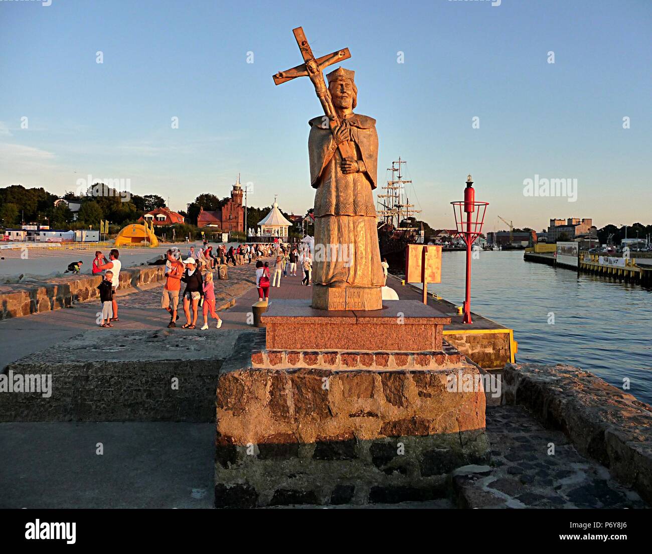 wood statue and harbor Stock Photo Alamy