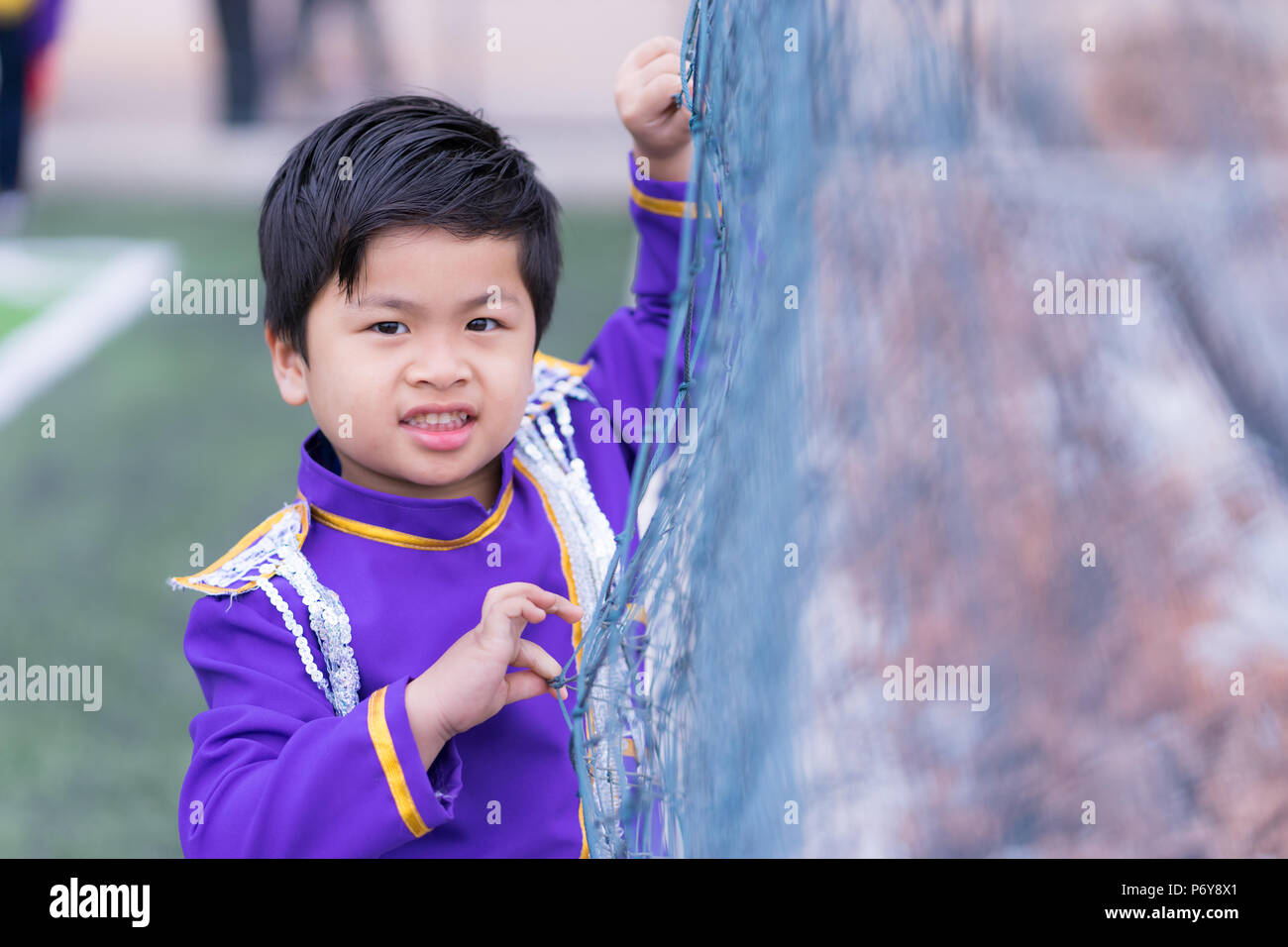 portrait cute Asian boy, little boy wear military band, Stock Photo