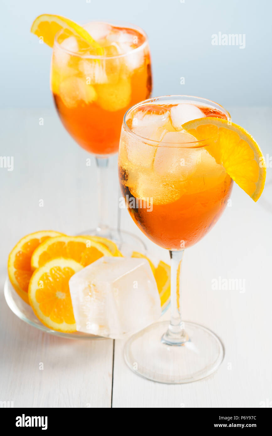 Aperol Spritz served with an orange slice in wine glasses. White background, high resolution Stock Photo