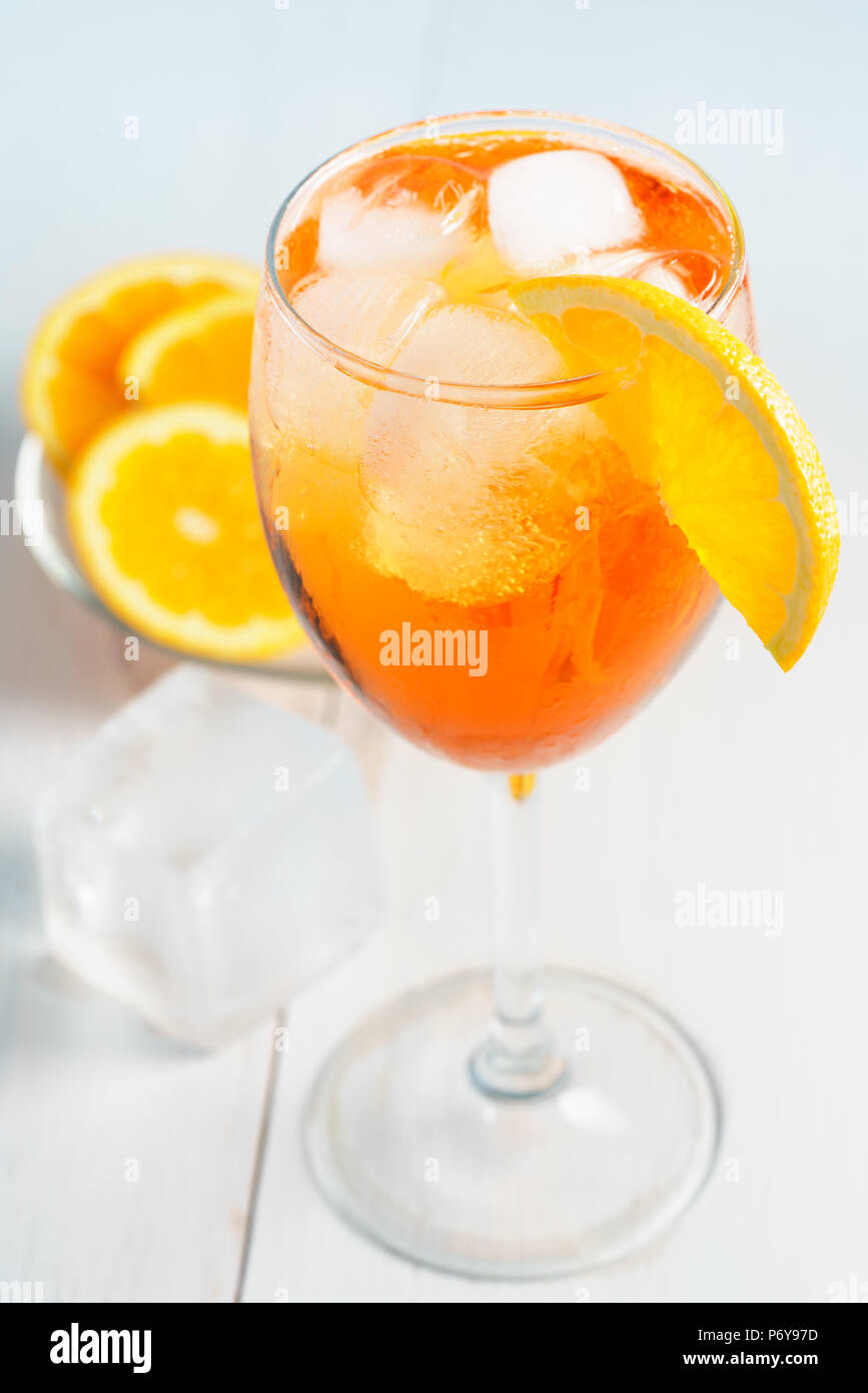 Aperol Spritz served with an orange slice in wine glass. White ...
