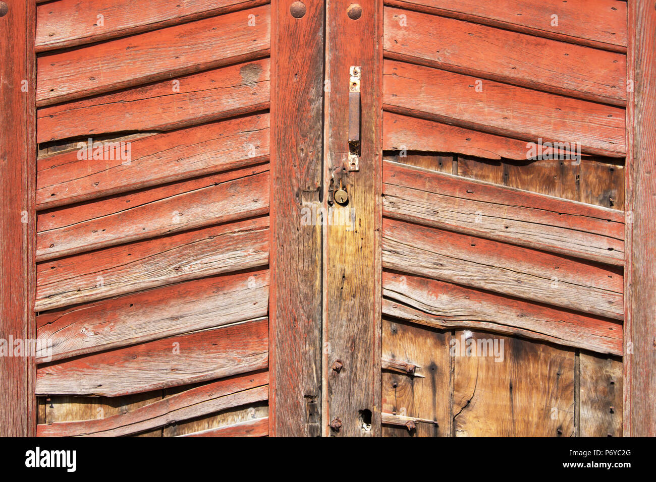 Ancient wooden door / old red  wooden door /  white background Stock Photo