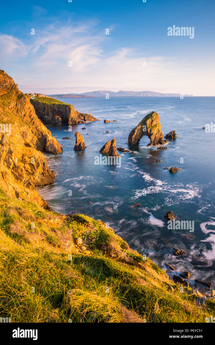 Crohy Head, County Donegal, Ulster region, Ireland, Europe. Sea arch stack and coastal cliffs seen from the top of the cliff. Stock Photo