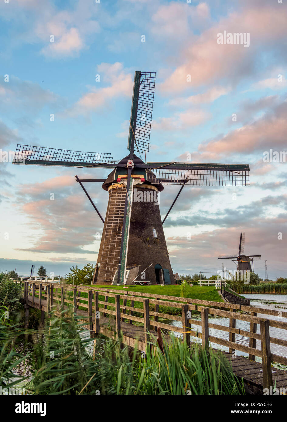 Windmills in Kinderdijk at sunset, UNESCO World Heritage Site, South Holland, The Netherlands Stock Photo