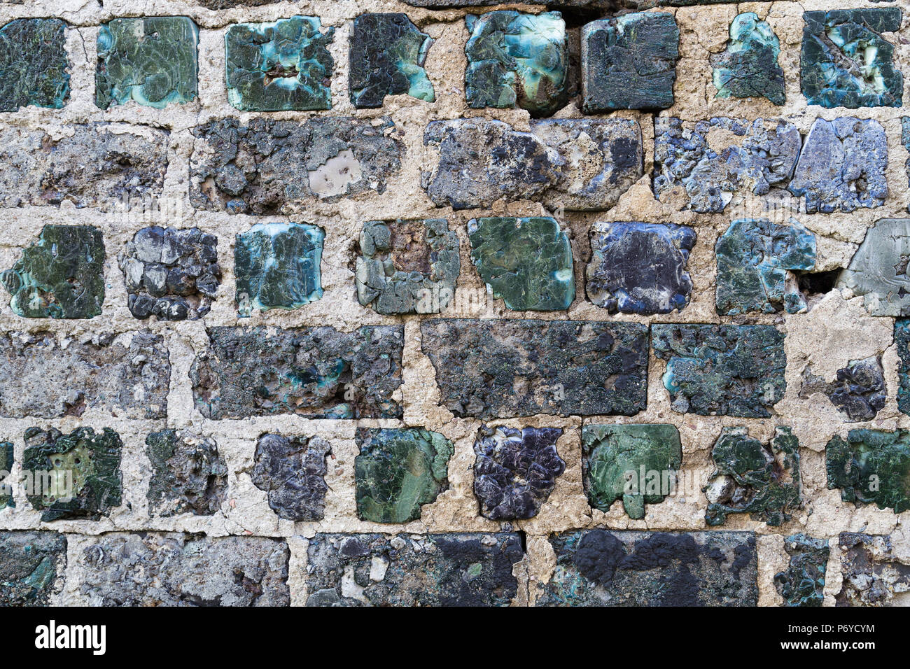 Handmade stone wall made of green, irregular slag stones in Kemiö Island, Finland Stock Photo