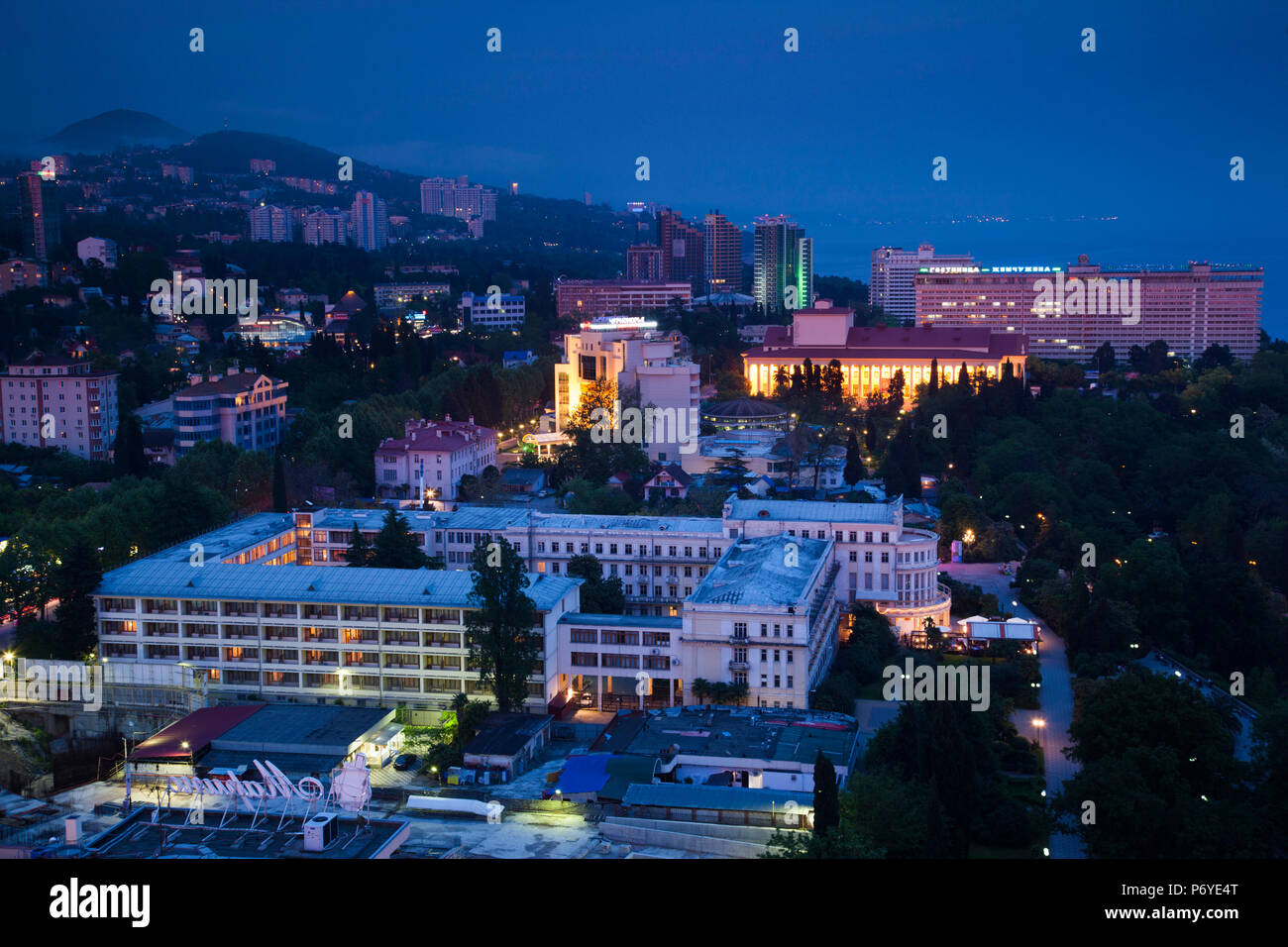 Russia, Black Sea Coast, Sochi, elevated view of central Sochi, dusk Stock Photo