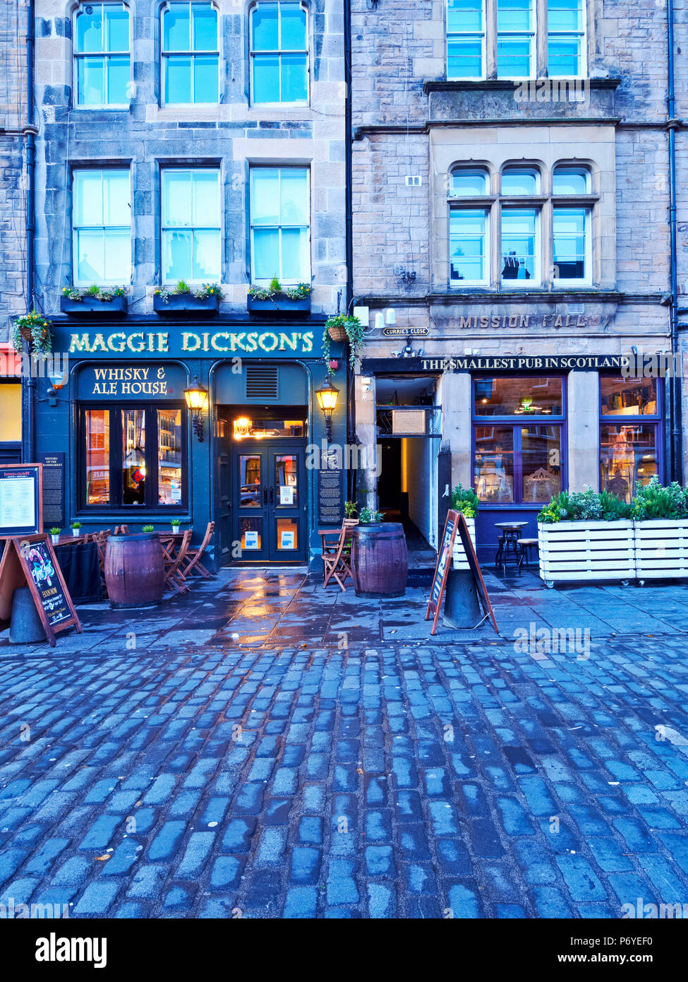 UK, Scotland, Lothian, Edinburgh, Grassmarket Square, Twilight view of the Maggie Dickson's and The Smallest Pub in Scotland. Stock Photo