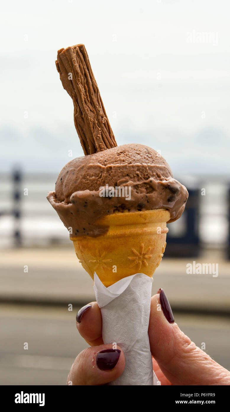 Close up view of a choclolate ice cream cone with a chocolate insert Stock Photo