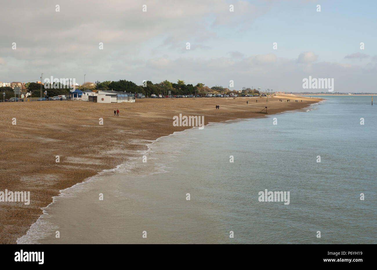 Beach at Southsea in Portsmouth, Hampshire, England. With people walking on beach. Stock Photo