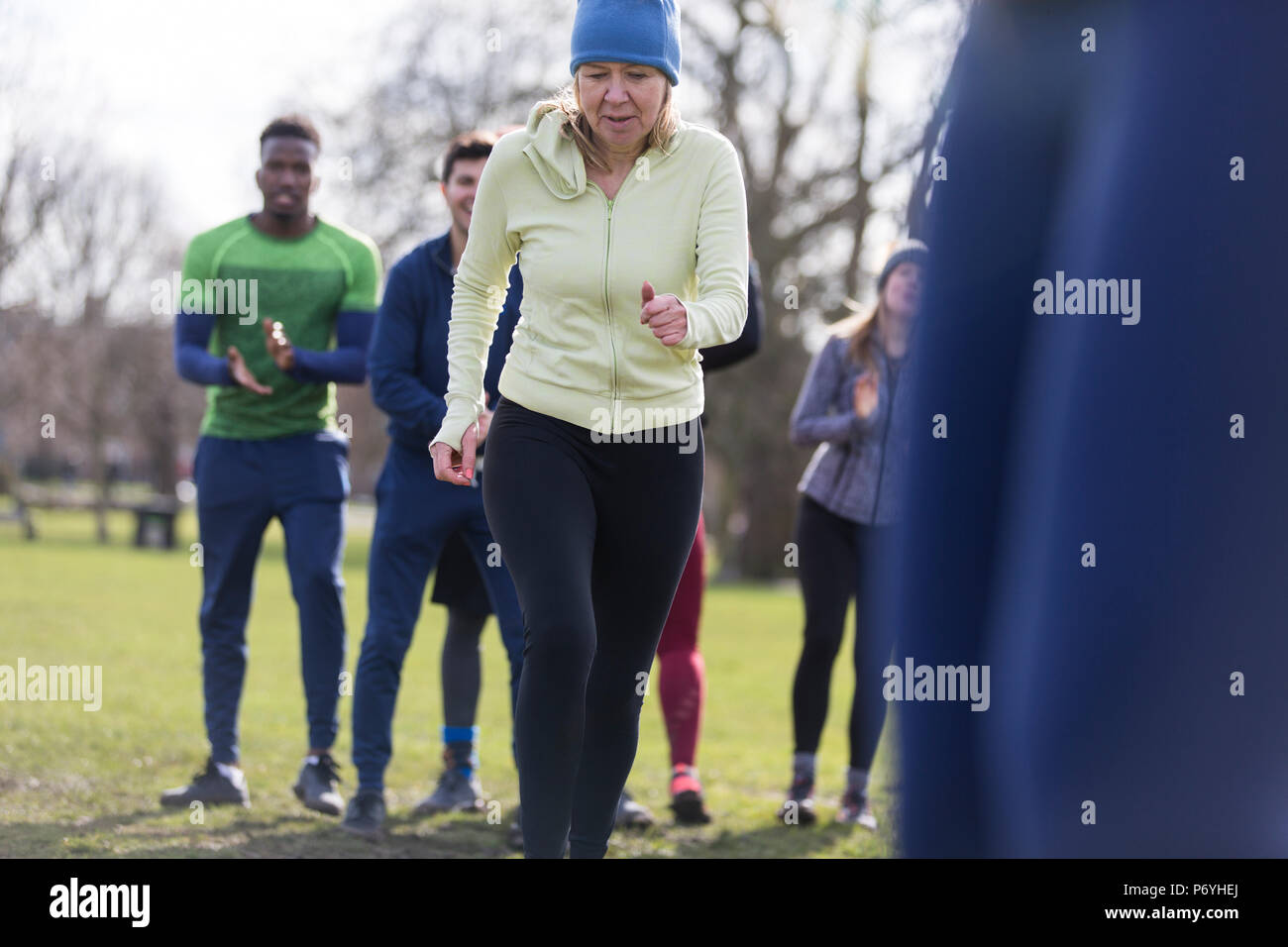 Determined senior woman exercising in park Stock Photo