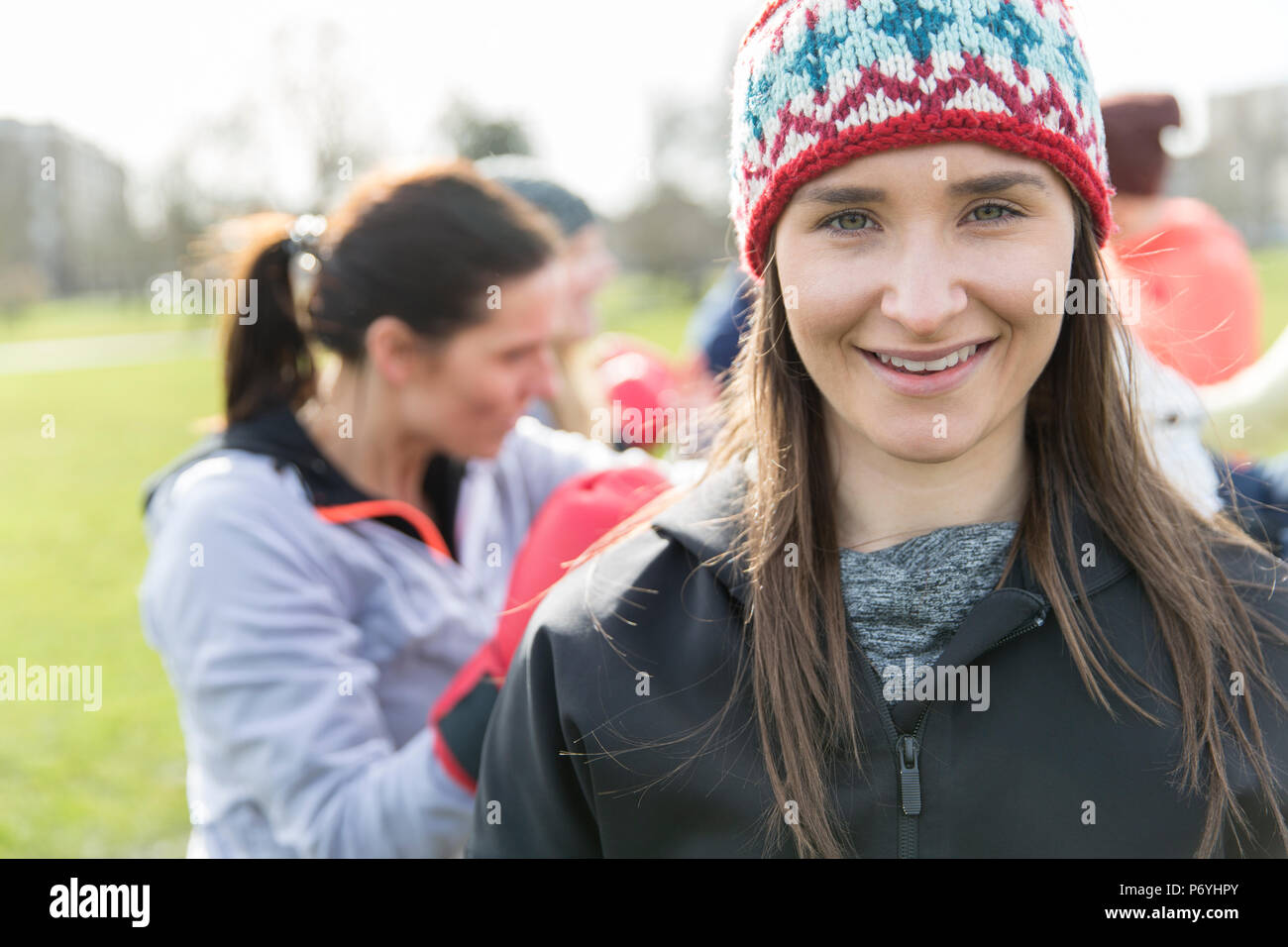 Portrait smiling, confident woman exercising in park Stock Photo