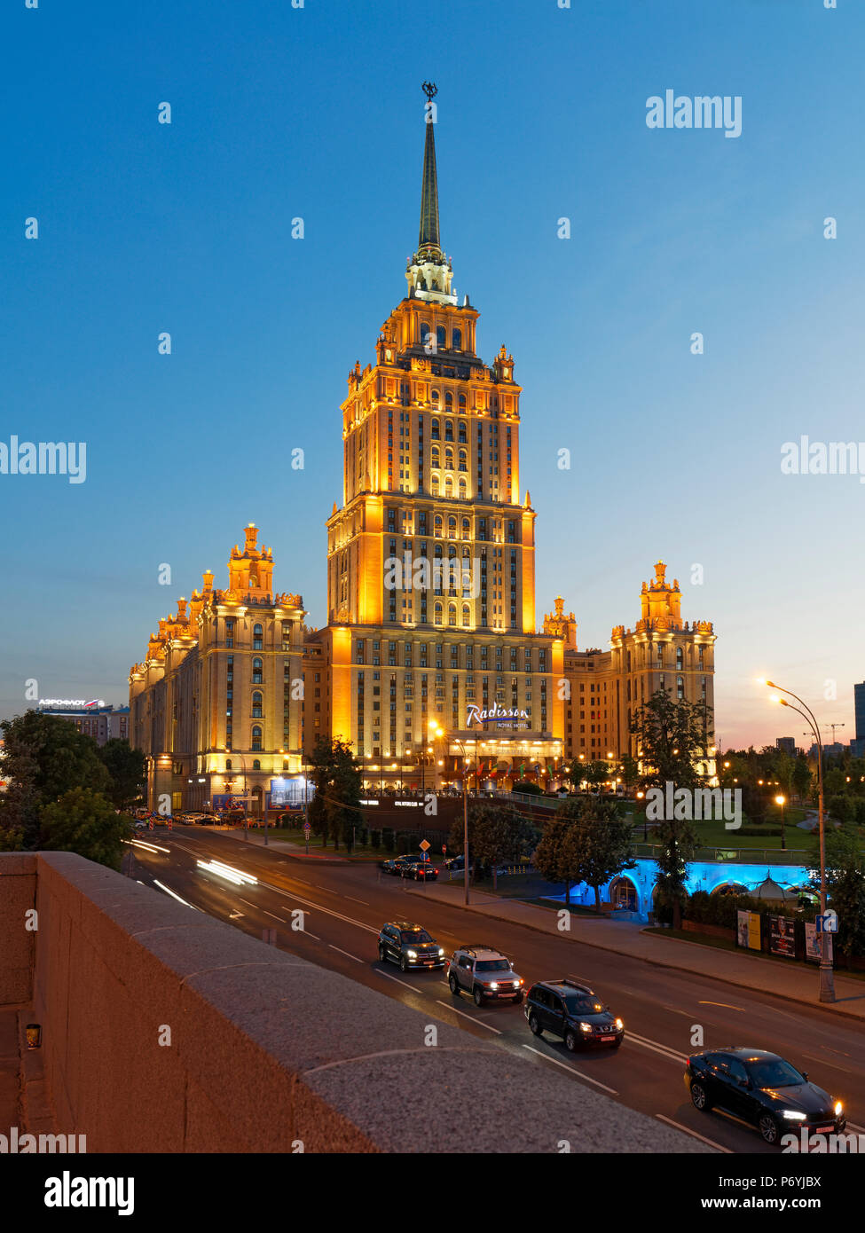 Radisson Royal Hotel Stalinist style high-rise building illuminated at dusk. Moscow, Russia. Stock Photo