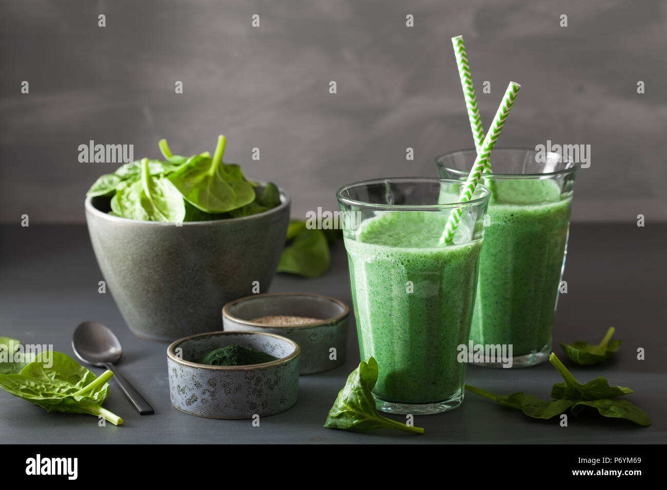 green spinach smoothie with spirulina, chia seed, lime, apple Stock