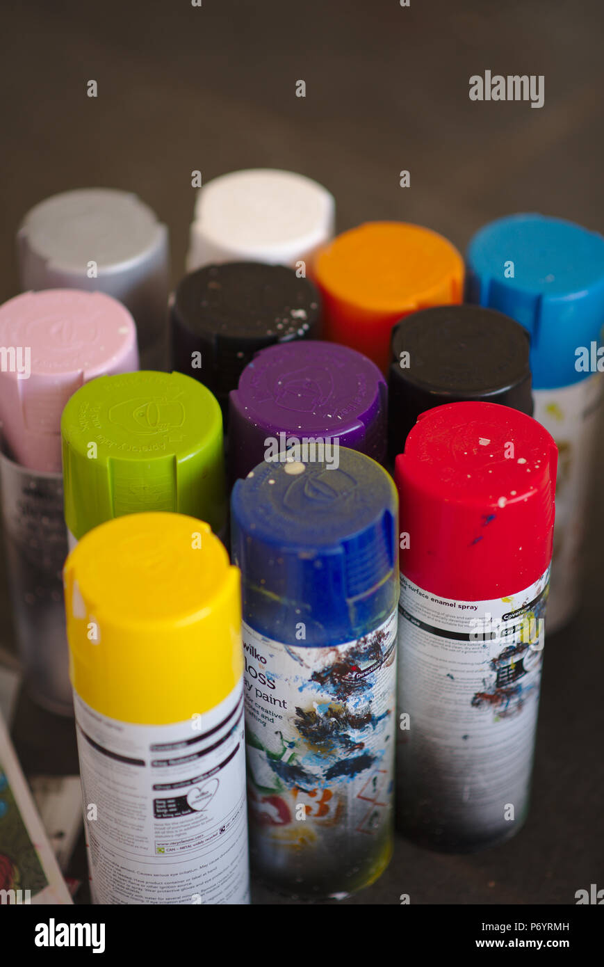 Various coloured spray paint can lids. Stock Photo